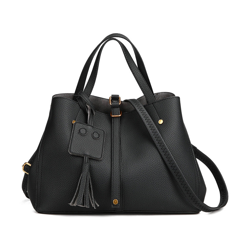 Tassel bucket bag in black PU leather