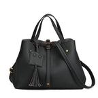 Tassel bucket bag in black PU leather