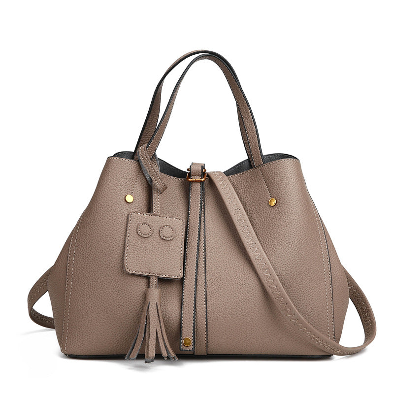 Tassel bucket bag in khaki PU leather