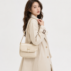 Saddle flap messenger bag worn over the shoulder