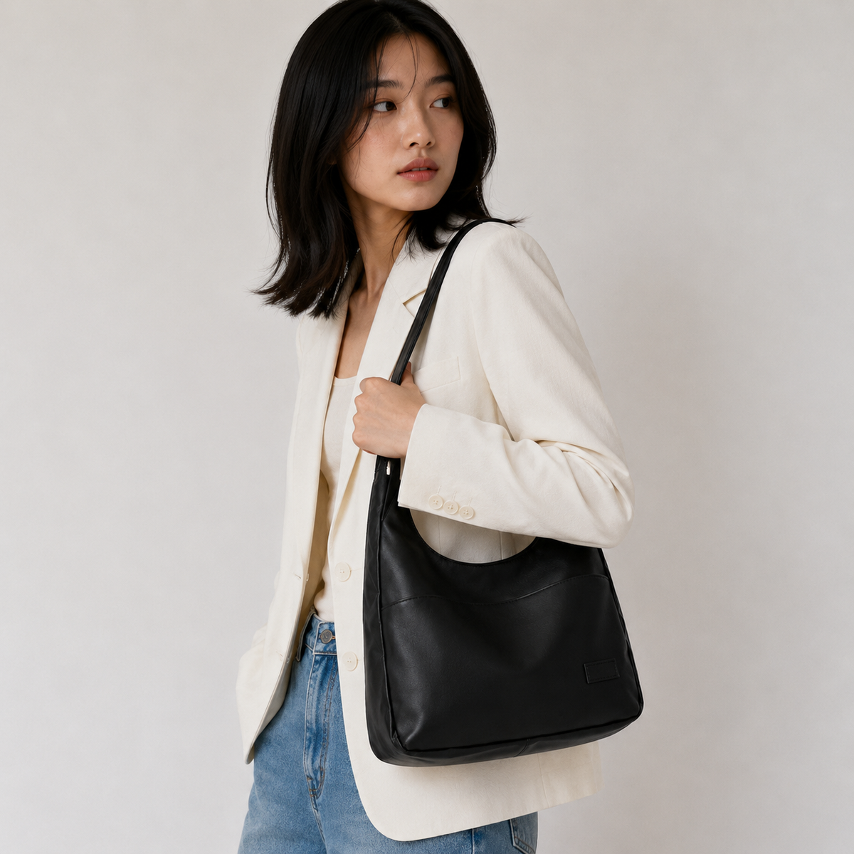 Soft hobo shoulder bag worn over the shoulder