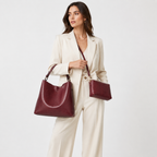 Two-piece tote set worn with the pouch as a crossbody