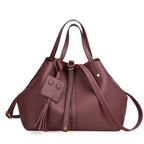 Tassel bucket bag in wine red PU leather