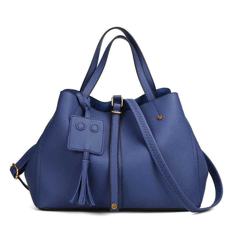 Tassel bucket bag in blue PU leather