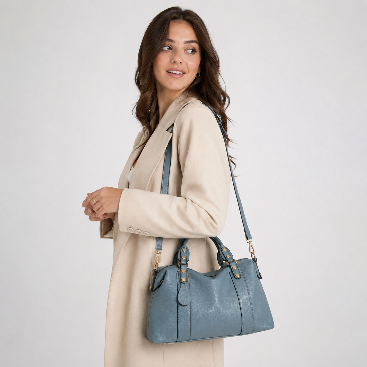 Studded satchel bag worn on the shoulder